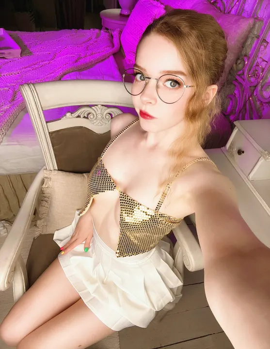 Gold sequin top and white skirt selfie