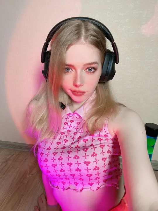 Pink patterned top and headphones