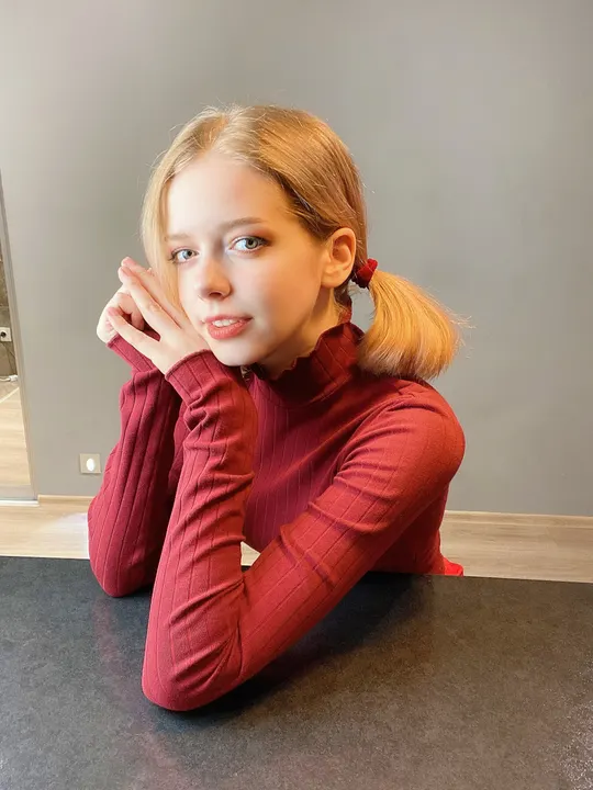 Red turtleneck at a table