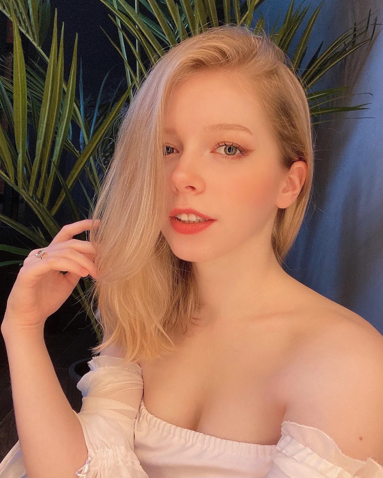 White off-shoulder top indoors